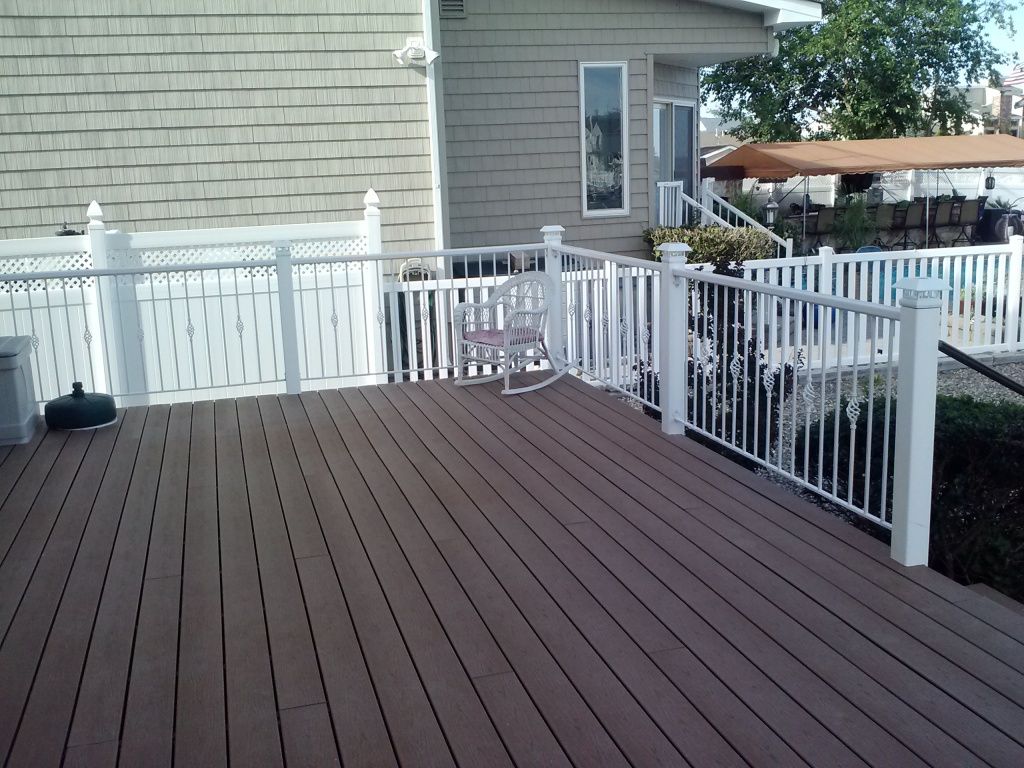 Metal handrails on a wooden deck. Any Ideas?