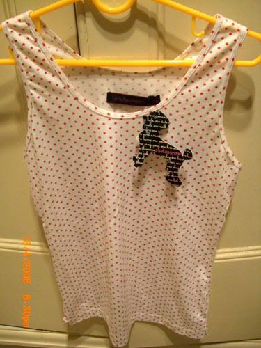 Loose white singlet with tiny red stars, haha erina got the same one but with black stars