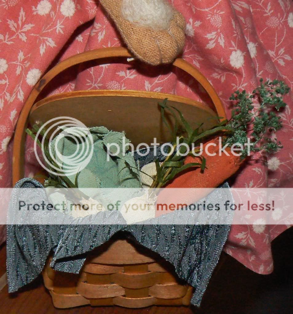   floral stems the vegetables are arranged atop a blue silky blend cloth